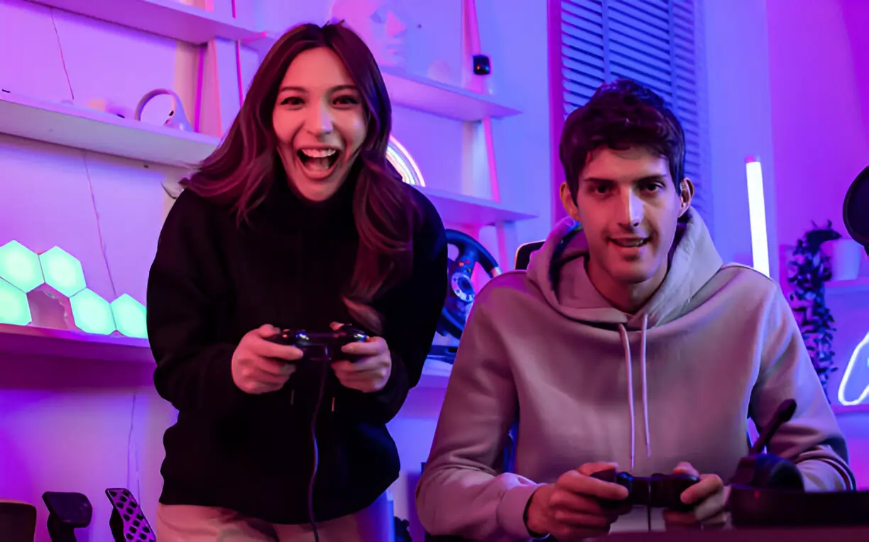 https://www.istockphoto.com/photo/happy-couple-or-friends-smiling-with-fun-using-joystick-to-compete-and-play-games-gm1469792373-500875264